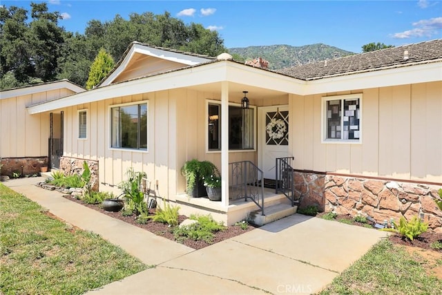 view of front facade featuring board and batten siding and a mountain view