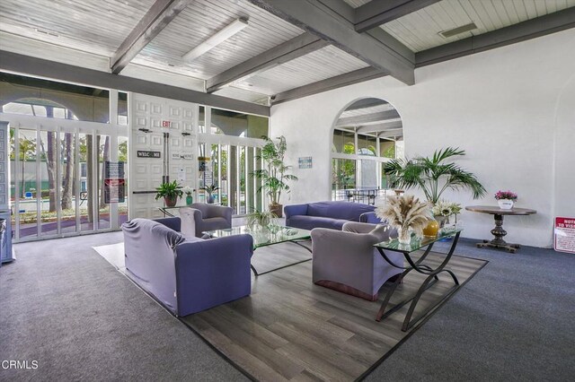 community lobby featuring beam ceiling