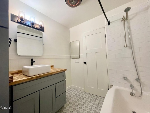full bathroom with tile patterned floors, vanity, and shower / bathtub combination