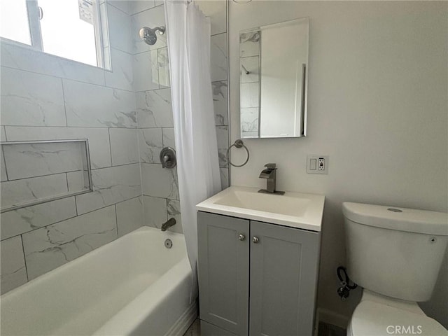 full bath featuring toilet, shower / bath combo, and vanity