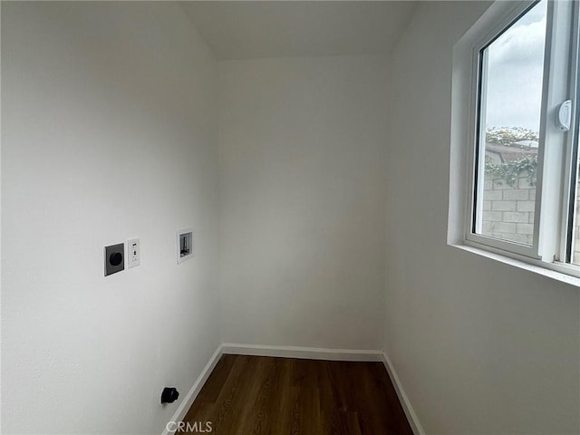 washroom with electric dryer hookup, hookup for a washing machine, dark wood-style floors, and baseboards