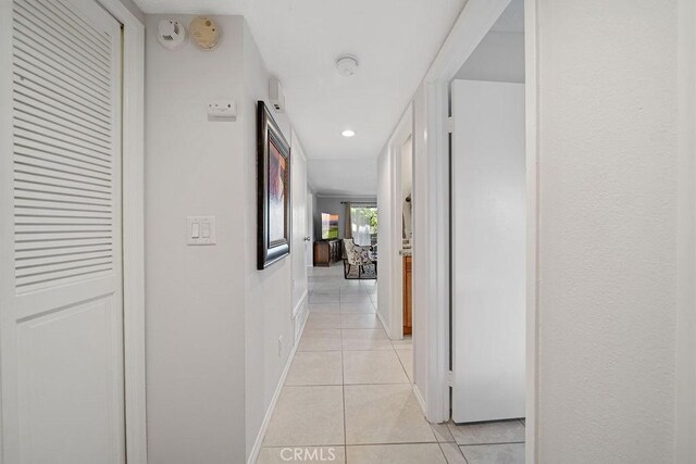 3155 E Ramon Rd Unit 607, Palm Springs, CA 92264 - corridor featuring light tile patterned flooring and baseboards
