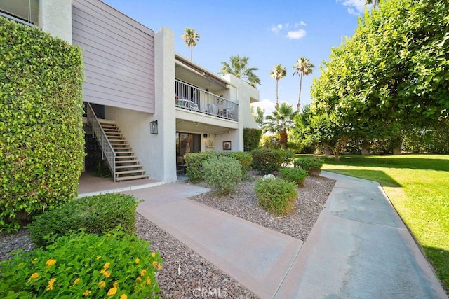 3155 E Ramon Rd Unit 607, Palm Springs, CA 92264 - view of property's community with stairs and a yard