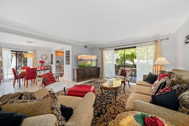 3155 E Ramon Rd Unit 607, Palm Springs, CA 92264 - living area with healthy amount of natural light, ornamental molding, light tile patterned flooring, and baseboards