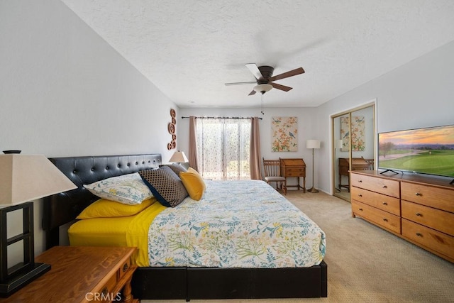3155 E Ramon Rd Unit 607, Palm Springs, CA 92264 - bedroom with light carpet, a textured ceiling, ceiling fan, and access to outside