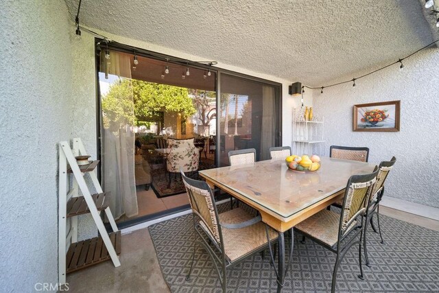 3155 E Ramon Rd Unit 607, Palm Springs, CA 92264 - view of patio featuring outdoor dining area
