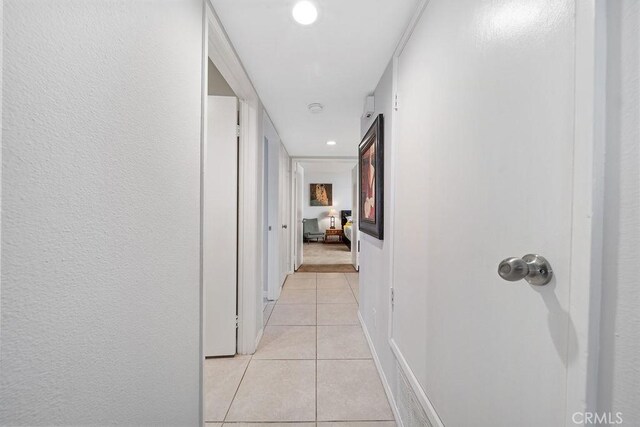 3155 E Ramon Rd Unit 607, Palm Springs, CA 92264 - hallway featuring light tile patterned floors and recessed lighting