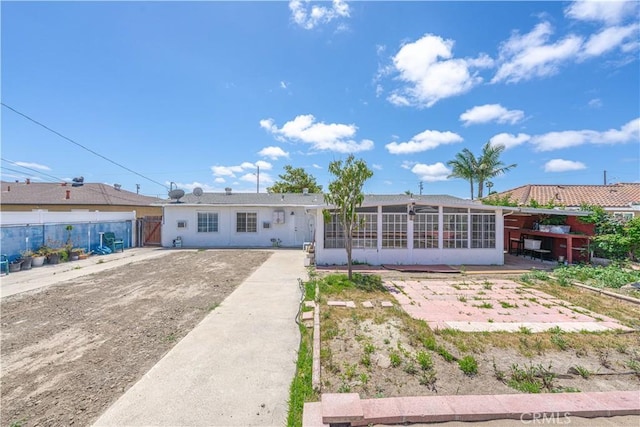 6371 Shawnee Rd, Westminster, CA 92683 - rear view of house featuring a sunroom
