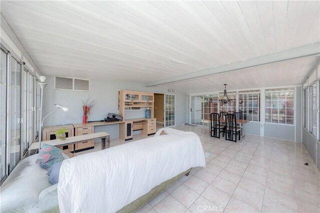 6371 Shawnee Rd, Westminster, CA 92683 - sunroom featuring beam ceiling, a chandelier, and healthy amount of natural light