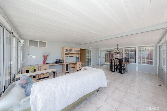 6371 Shawnee Rd, Westminster, CA 92683 - sunroom with beamed ceiling and a chandelier