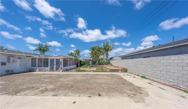 6371 Shawnee Rd, Westminster, CA 92683 - view of yard with a sunroom, a garden, and french doors
