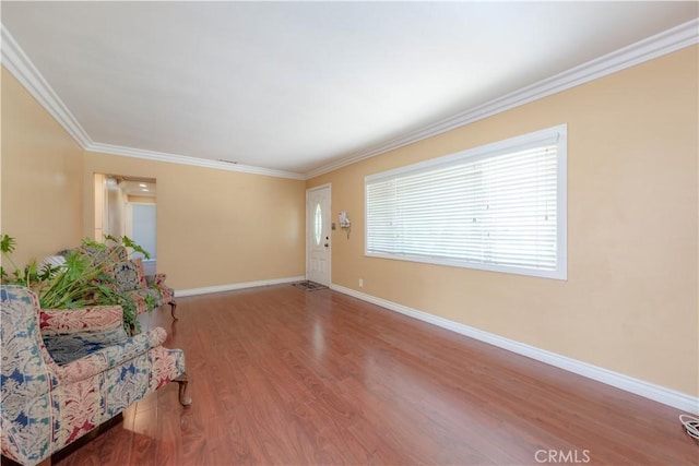 6371 Shawnee Rd, Westminster, CA 92683 - unfurnished living room with wood finished floors, baseboards, and crown molding