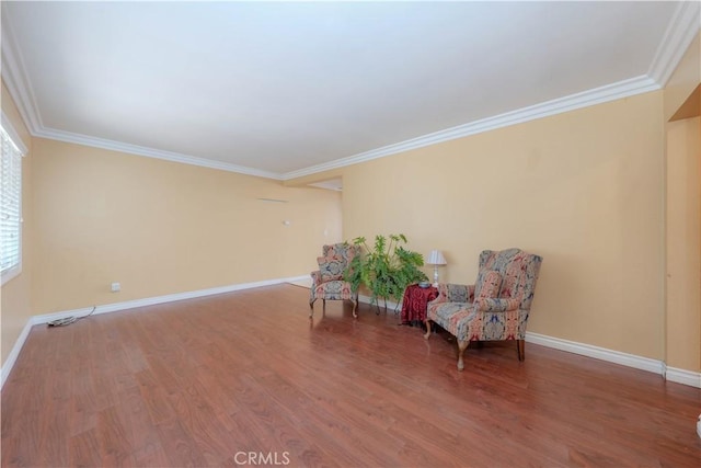 6371 Shawnee Rd, Westminster, CA 92683 - living area featuring wood finished floors, crown molding, and baseboards