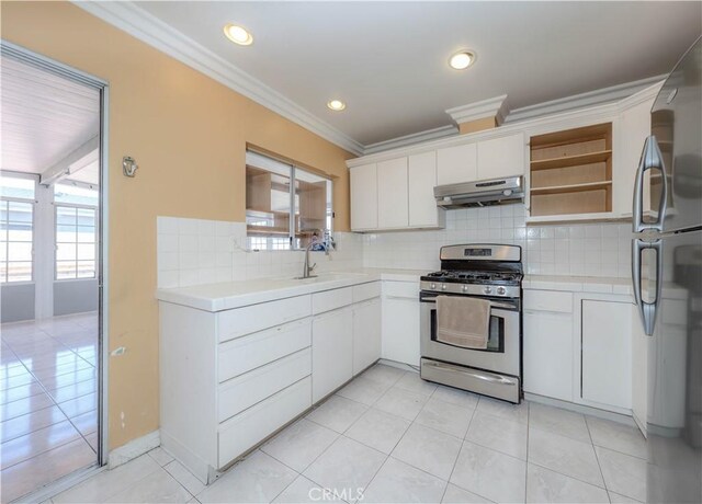 6371 Shawnee Rd, Westminster, CA 92683 - kitchen featuring stainless steel appliances, under cabinet range hood, plenty of natural light, a sink, and crown molding