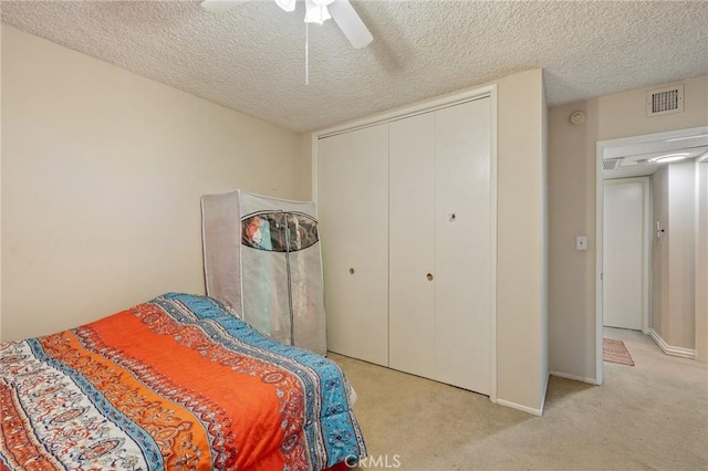 330 N Howard St Unit 201, Glendale, CA 91206 - bedroom with a textured ceiling, light carpet, a closet, and ceiling fan