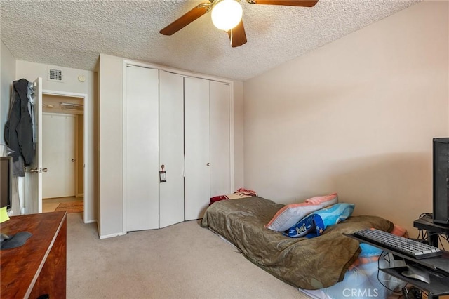 330 N Howard St Unit 201, Glendale, CA 91206 - bedroom featuring a closet, light carpet, a textured ceiling, and ceiling fan
