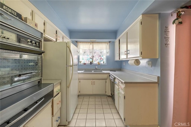 330 N Howard St Unit 201, Glendale, CA 91206 - kitchen with appliances with stainless steel finishes, light tile patterned floors, light countertops, and backsplash