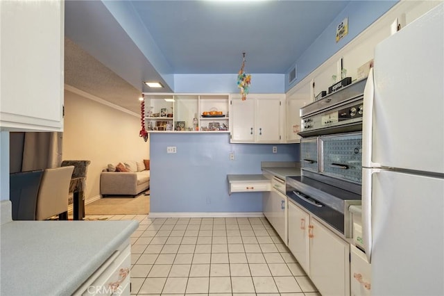 330 N Howard St Unit 201, Glendale, CA 91206 - kitchen with freestanding refrigerator, white cabinets, light tile patterned floors, open shelves, and ornamental molding