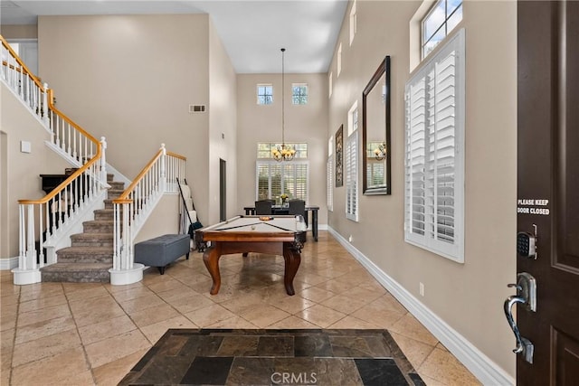 30463 Vineyard Ln, Castaic, CA 91384 - entrance foyer featuring stairs, pool table, a towering ceiling, baseboards, and a chandelier