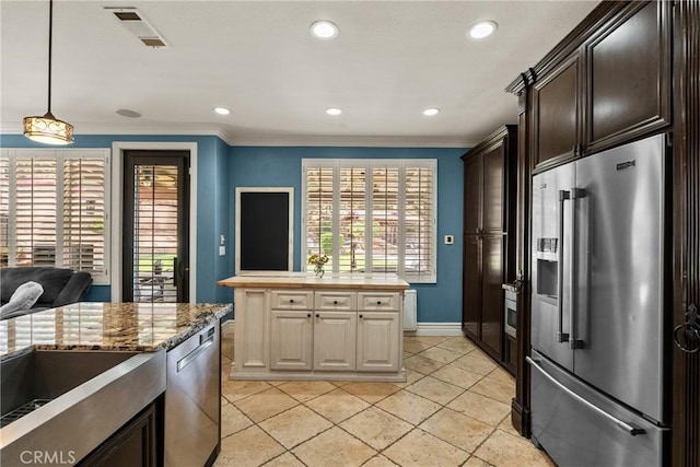 30463 Vineyard Ln, Castaic, CA 91384 - kitchen with appliances with stainless steel finishes, crown molding, dark brown cabinetry, baseboards, and recessed lighting