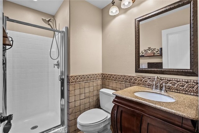 30463 Vineyard Ln, Castaic, CA 91384 - full bathroom with a stall shower, toilet, vanity, a wainscoted wall, and tile walls