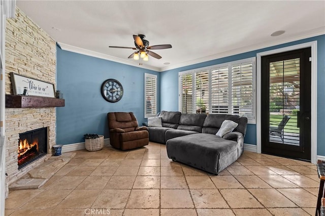 30463 Vineyard Ln, Castaic, CA 91384 - living area featuring ceiling fan, healthy amount of natural light, a stone fireplace, crown molding, and baseboards