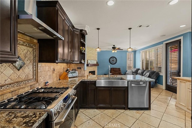 30463 Vineyard Ln, Castaic, CA 91384 - kitchen with stainless steel appliances, wall chimney exhaust hood, a sink, open floor plan, and decorative backsplash