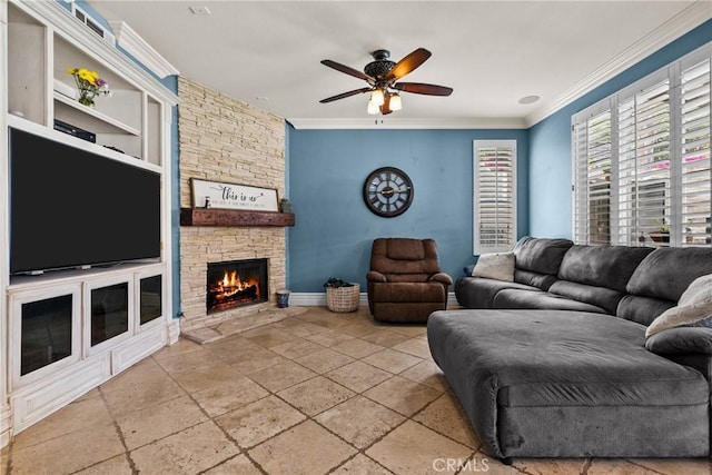 30463 Vineyard Ln, Castaic, CA 91384 - living room with crown molding, a ceiling fan, a stone fireplace, stone tile floors, and baseboards