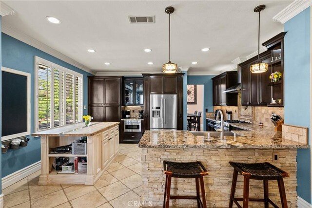 30463 Vineyard Ln, Castaic, CA 91384 - kitchen featuring stainless steel fridge with ice dispenser, ornamental molding, backsplash, dark brown cabinets, and recessed lighting
