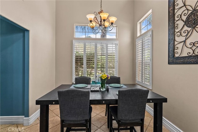 30463 Vineyard Ln, Castaic, CA 91384 - dining space with a chandelier, a towering ceiling, and baseboards