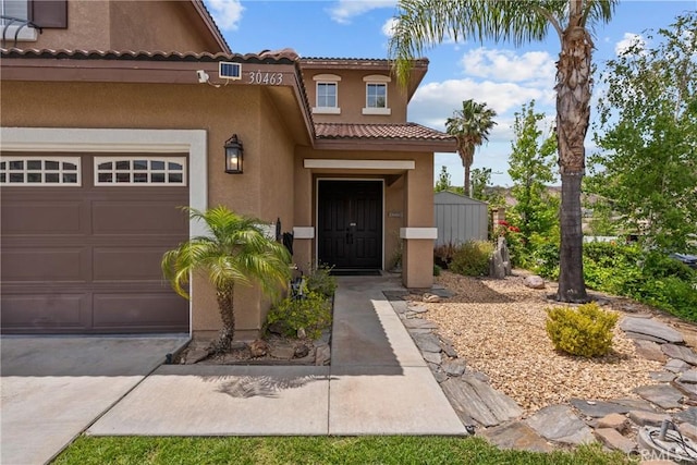 30463 Vineyard Ln, Castaic, CA 91384 - property entrance featuring stucco siding, a tiled roof, and a garage