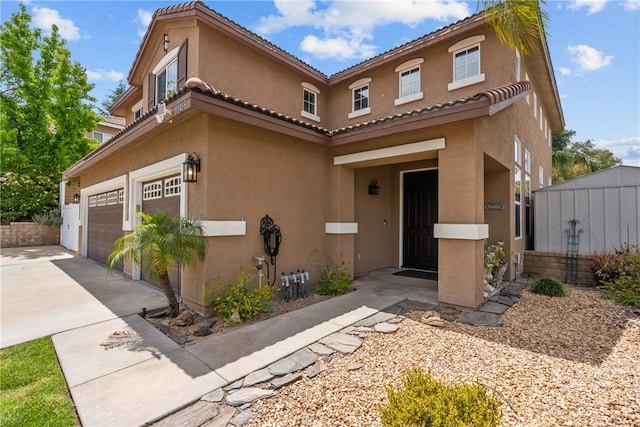 30463 Vineyard Ln, Castaic, CA 91384 - mediterranean / spanish home featuring stucco siding, an attached garage, driveway, and a tiled roof