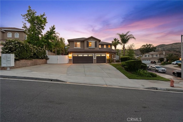30463 Vineyard Ln, Castaic, CA 91384 - traditional-style house featuring concrete driveway, an attached garage, and a gate