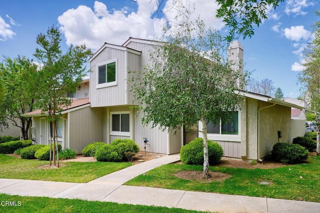 14886 Reedley St Unit A, Moorpark, CA 93021 - view of front of property featuring a chimney and a front lawn
