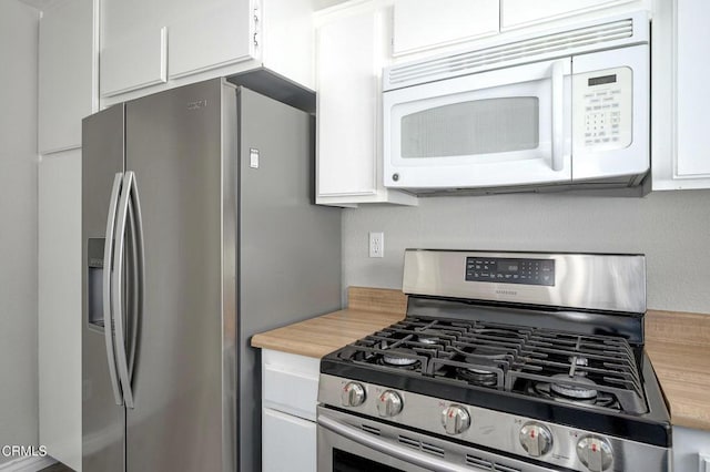 14886 Reedley St Unit A, Moorpark, CA 93021 - kitchen featuring stainless steel appliances and white cabinets