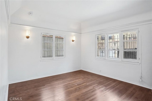 4235 Garthwaite Ave, Los Angeles, CA 90008 - empty room with wood finished floors, baseboards, and a smoke detector