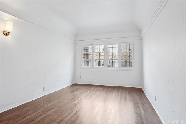 4235 Garthwaite Ave, Los Angeles, CA 90008 - spare room featuring wood finished floors, lofted ceiling, and baseboards
