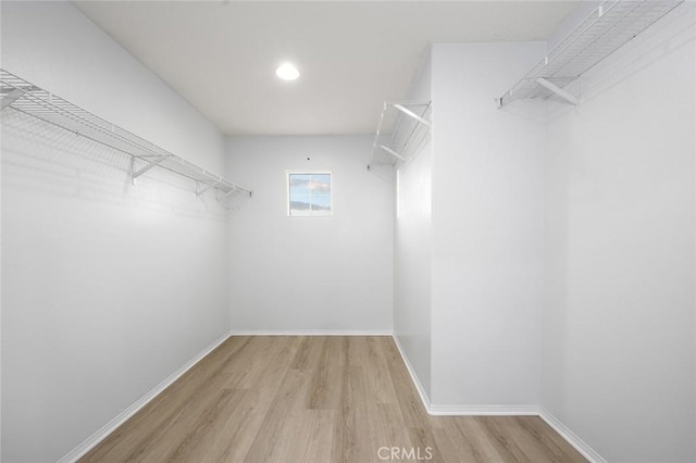 14271 Blackstone St, Hesperia, CA 92345 - walk in closet featuring wood finished floors