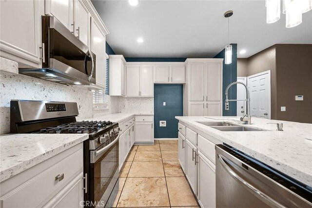 14271 Blackstone St, Hesperia, CA 92345 - kitchen featuring appliances with stainless steel finishes, a sink, white cabinets, tasteful backsplash, and light stone countertops