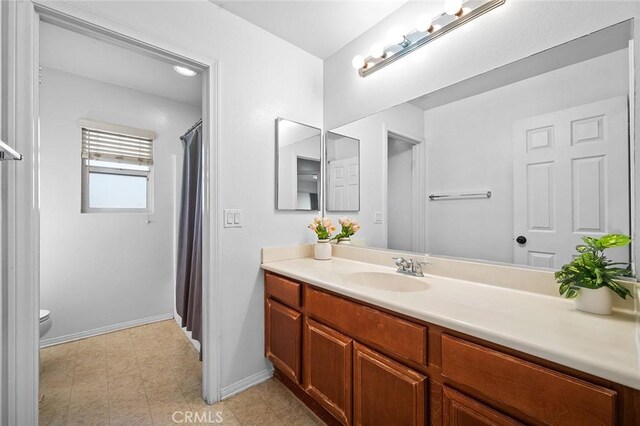14271 Blackstone St, Hesperia, CA 92345 - full bath with vanity, baseboards, toilet, and curtained shower