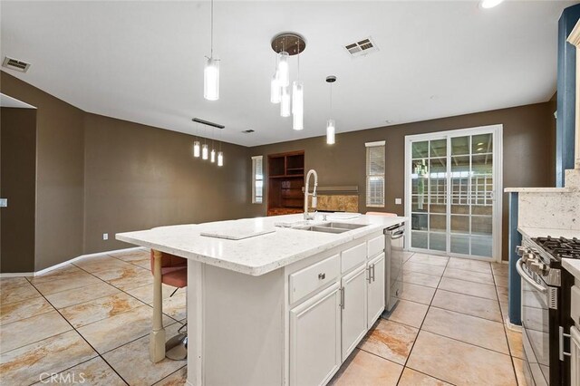 14271 Blackstone St, Hesperia, CA 92345 - kitchen with a sink, appliances with stainless steel finishes, white cabinetry, and healthy amount of natural light