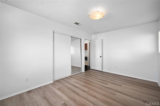 14271 Blackstone St, Hesperia, CA 92345 - unfurnished bedroom with wood finished floors, a closet, and baseboards