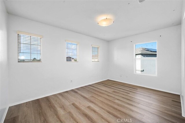 14271 Blackstone St, Hesperia, CA 92345 - empty room with wood finished floors and baseboards