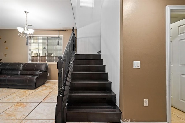 14271 Blackstone St, Hesperia, CA 92345 - staircase with tile patterned flooring and a chandelier