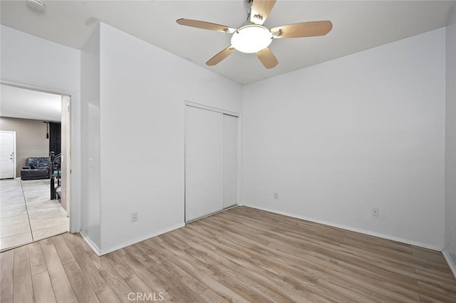 14271 Blackstone St, Hesperia, CA 92345 - unfurnished bedroom featuring light wood finished floors, a closet, baseboards, and ceiling fan