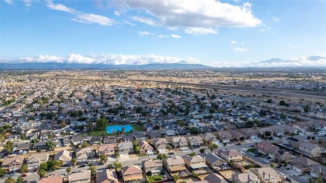 14271 Blackstone St, Hesperia, CA 92345 - aerial view of property and surrounding area featuring nearby suburban area and a mountainous background