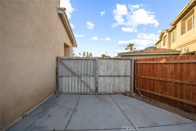 14271 Blackstone St, Hesperia, CA 92345 - view of patio with fence and a gate