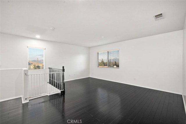 14271 Blackstone St, Hesperia, CA 92345 - spare room with dark wood-type flooring, recessed lighting, and baseboards