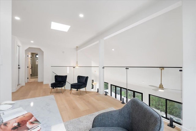 2464 Haller St, San Diego, CA 92104 - sitting room with wood finished floors, arched walkways, high vaulted ceiling, recessed lighting, and a ceiling fan