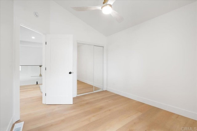 2464 Haller St, San Diego, CA 92104 - unfurnished bedroom featuring vaulted ceiling, light wood-style flooring, a closet, baseboards, and ceiling fan